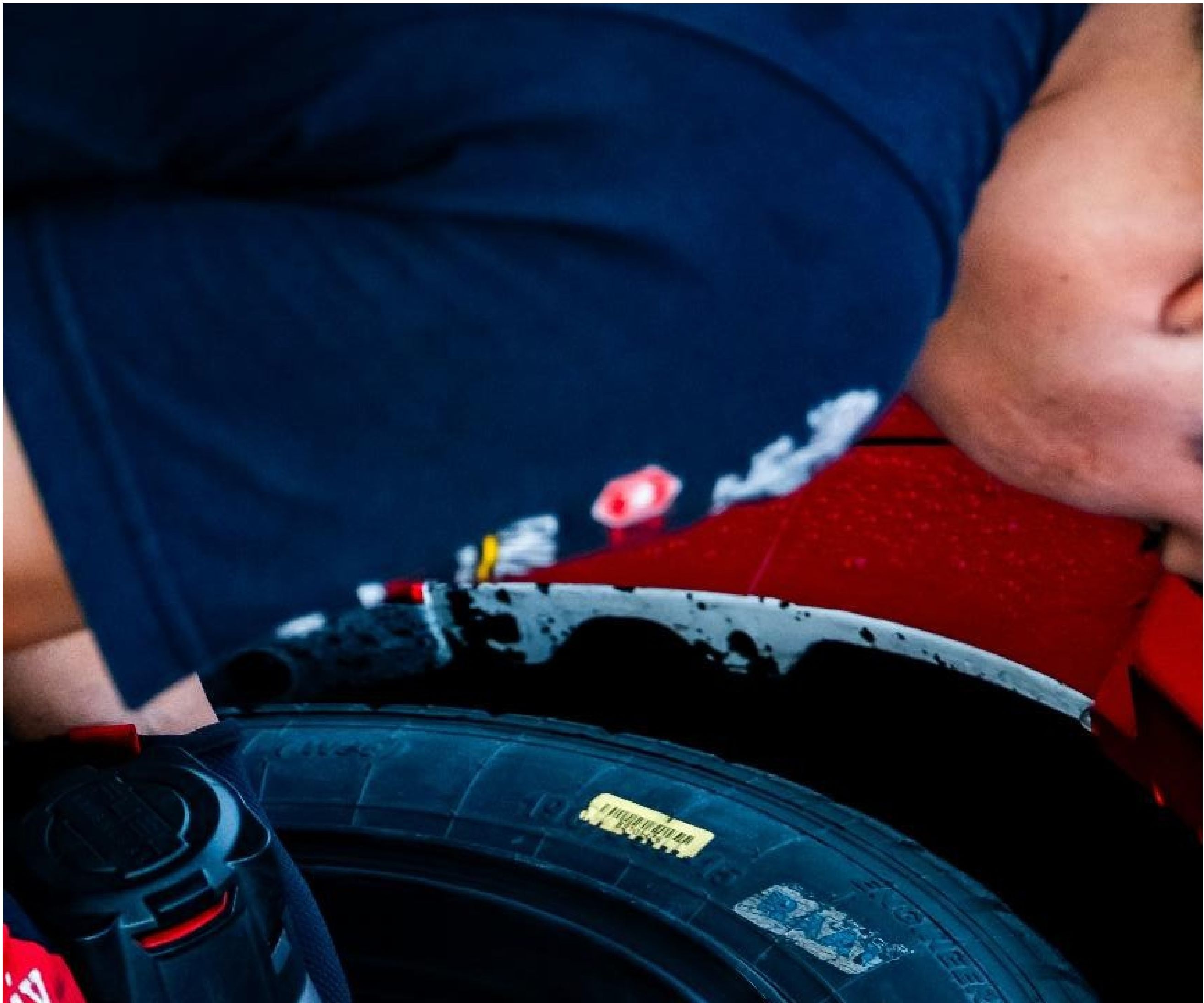 Technician working on a vehicle tire