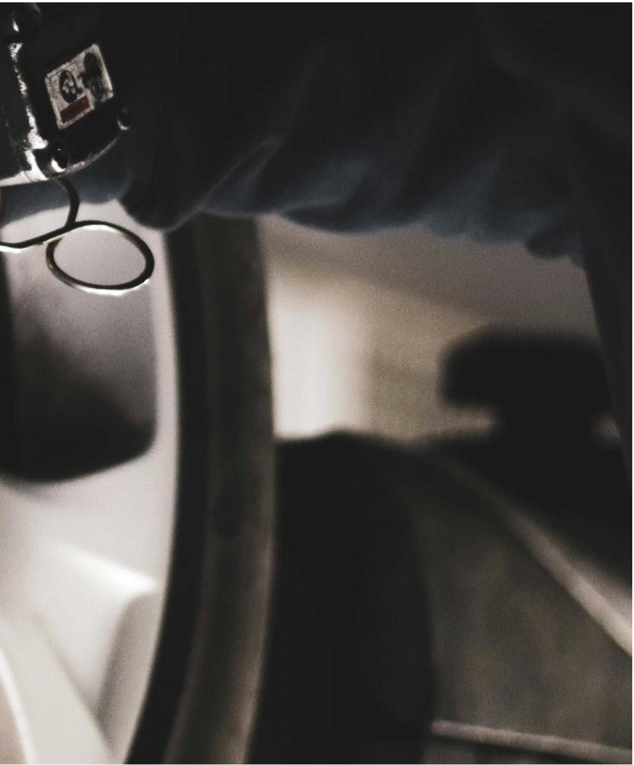 Close-up of a hand holding a tire pressure measuring device