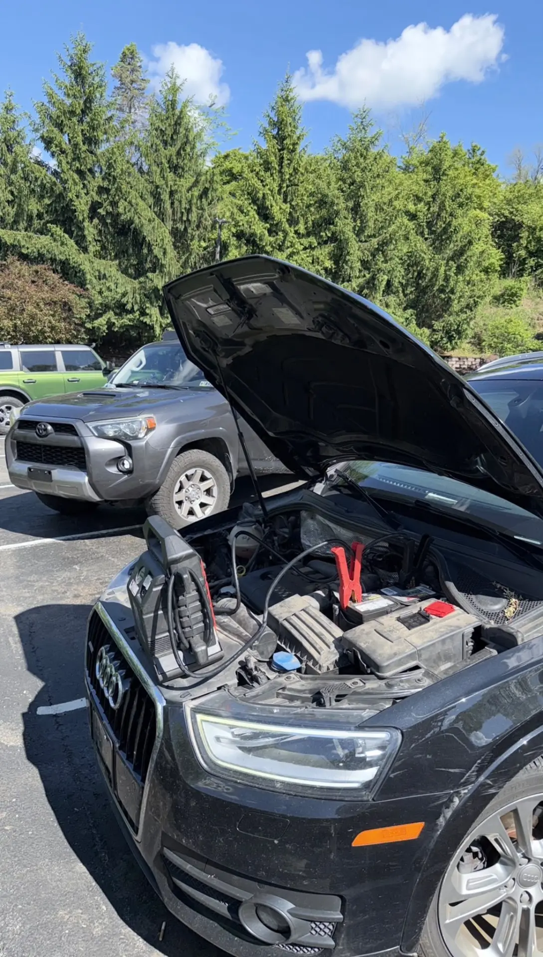 Jump start service on a black Audi SUV in Columbus, OH