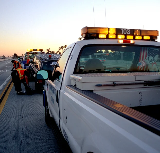 RoadMate Services tow truck assisting a driver