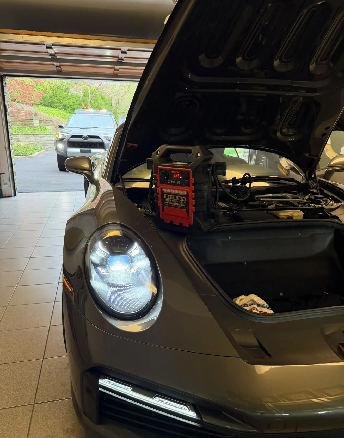 Jump start service on a Porsche in a Columbus garage