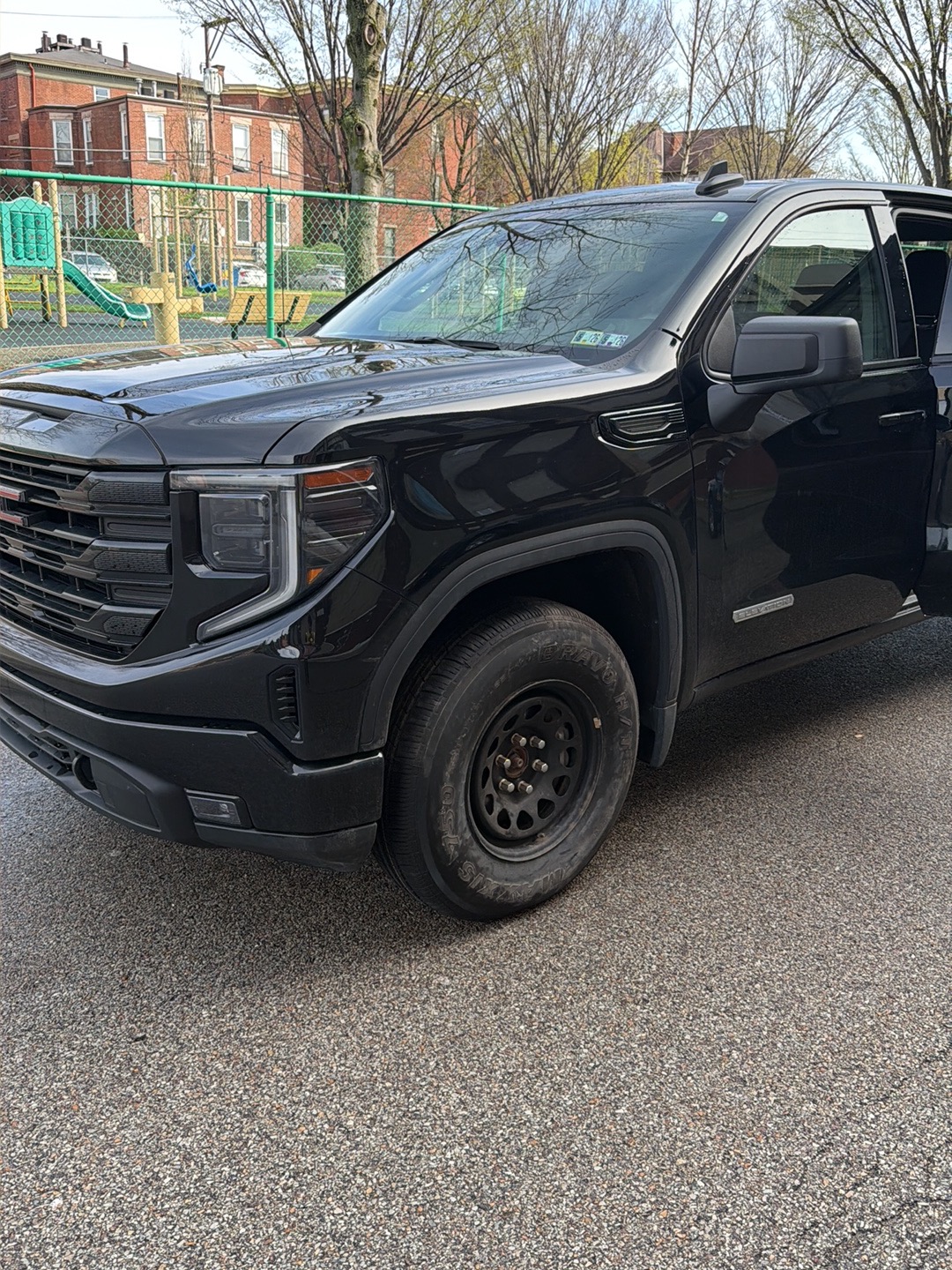 Technician assisting a driver locked out of their vehicle